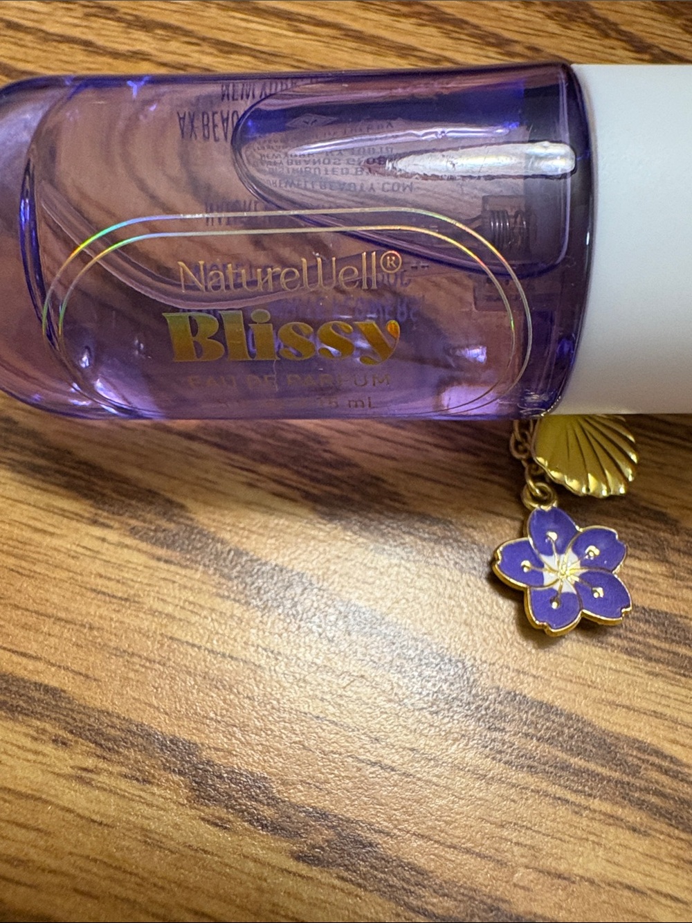 Bliss Purple Bottle with Gold Flower Charm perfume spray